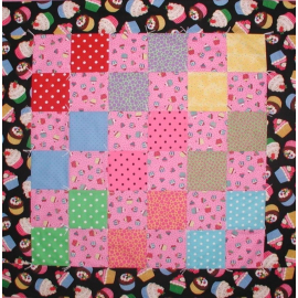 Baby girls quilt with cupcakes